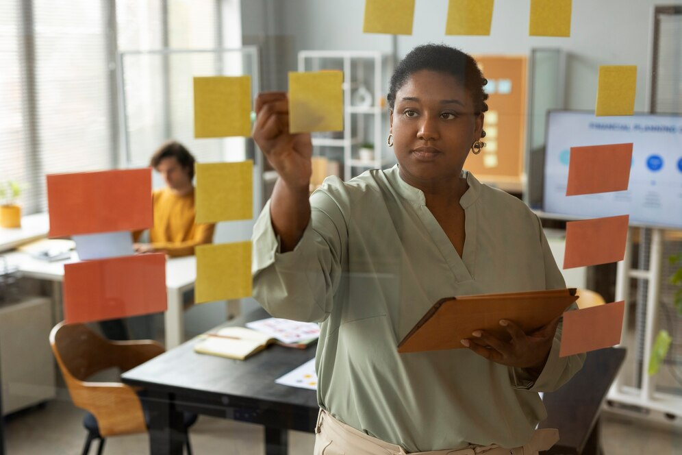 Woman working with sticky notes