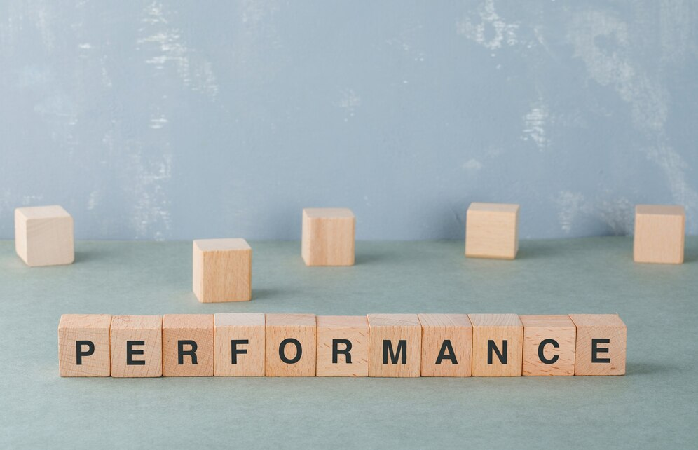 Performance business concept with wooden blocks