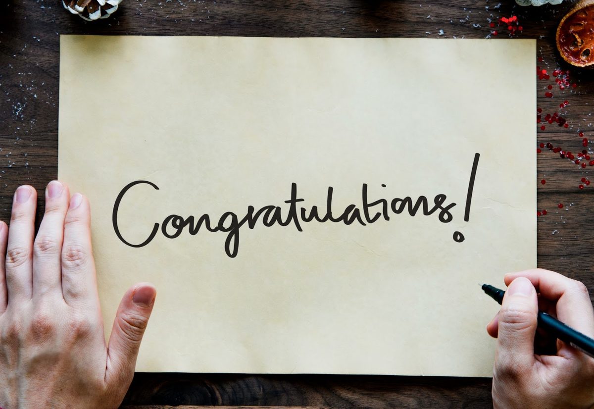 Congratulations note written on yellow paper