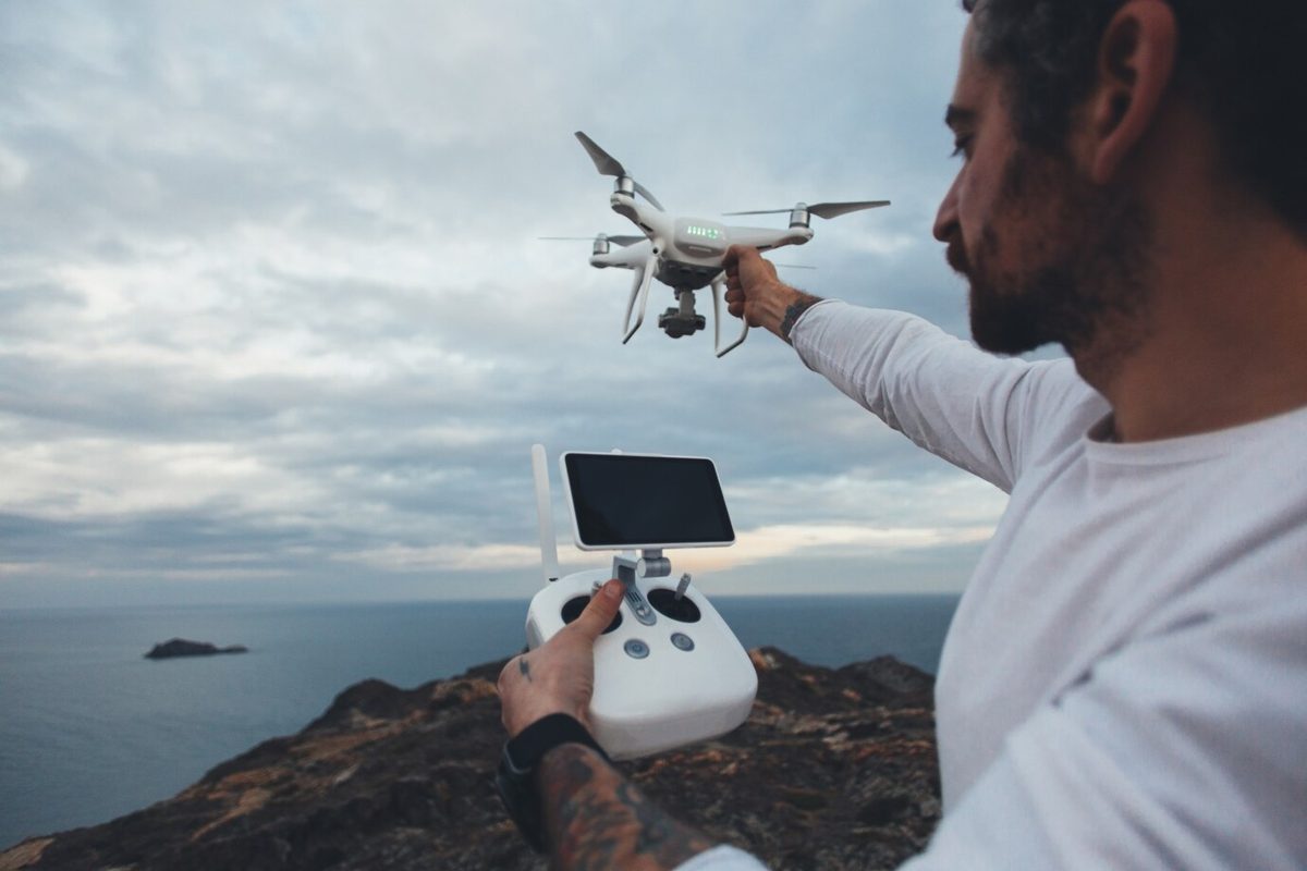 Professional drone pilot operating a drone for property photography