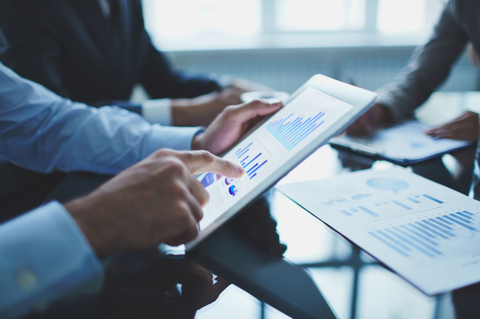 Businessman with digital tablet checking progress