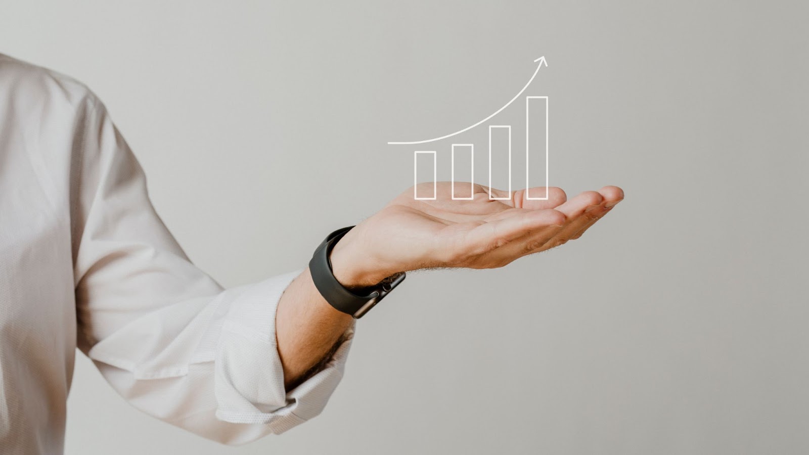 Digital bar graph with businessman hand overlay