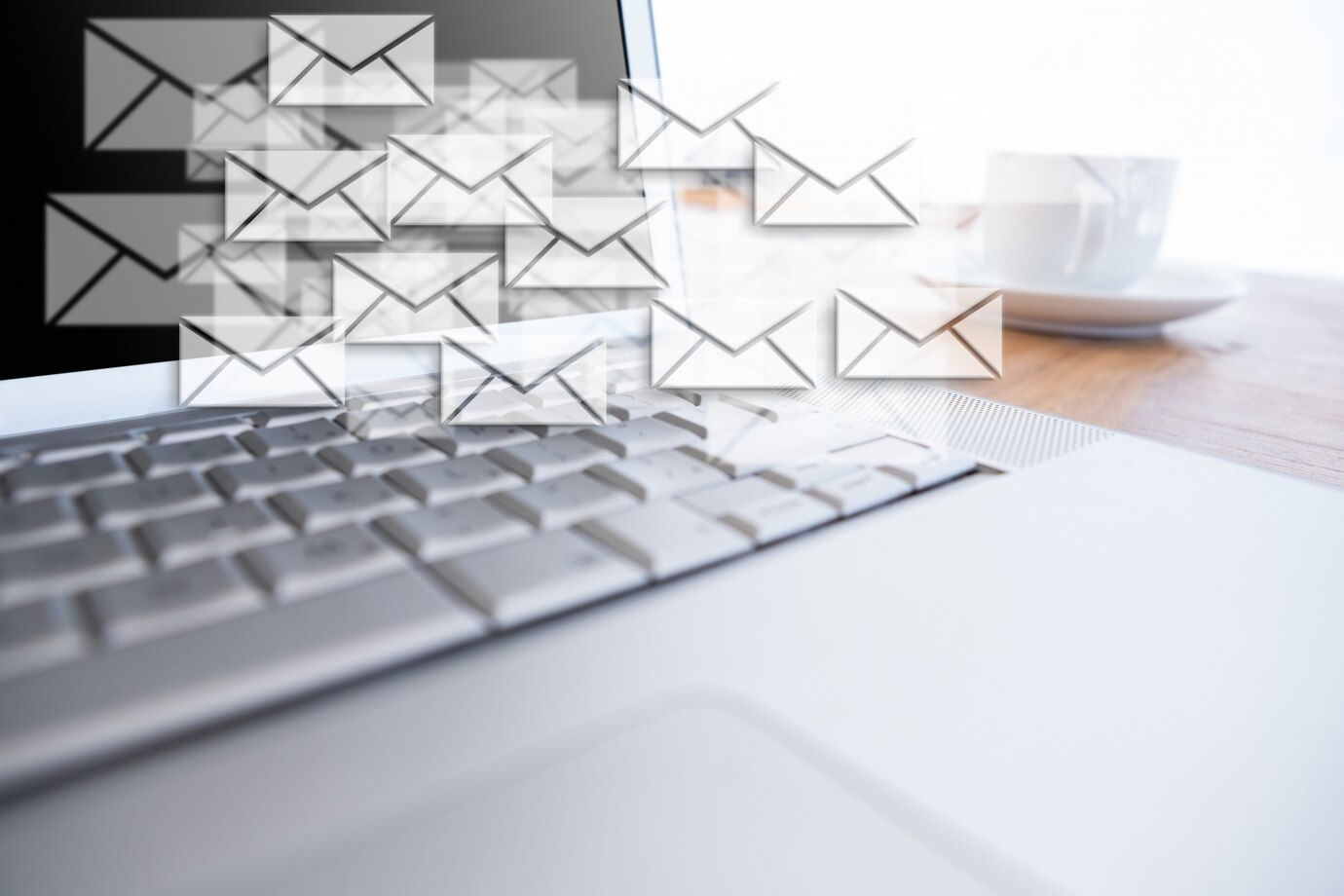 Email messages floating around a laptop