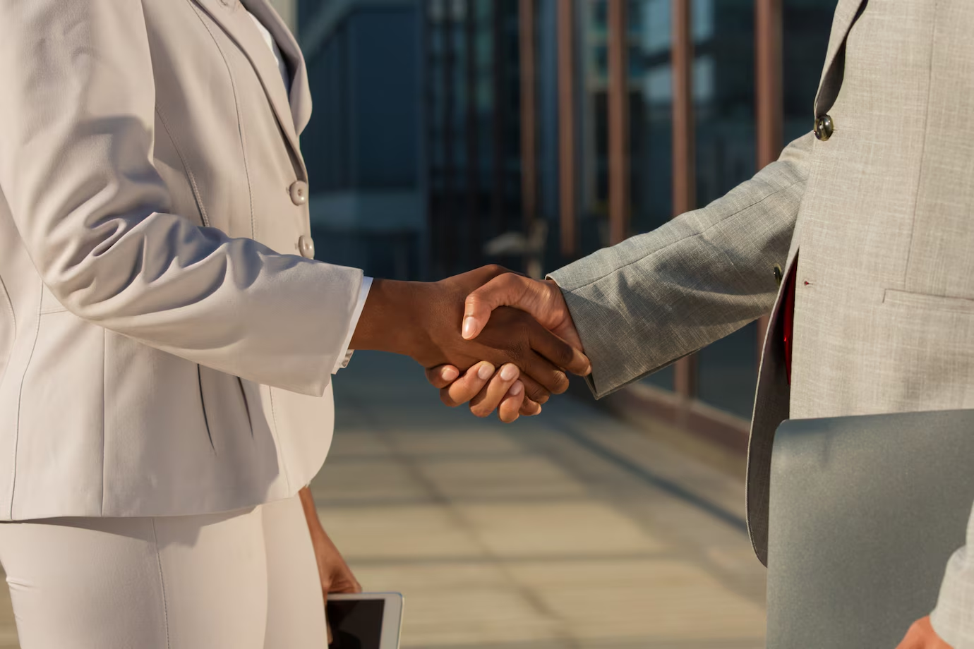 Businesswoman shaking hands with a male partner