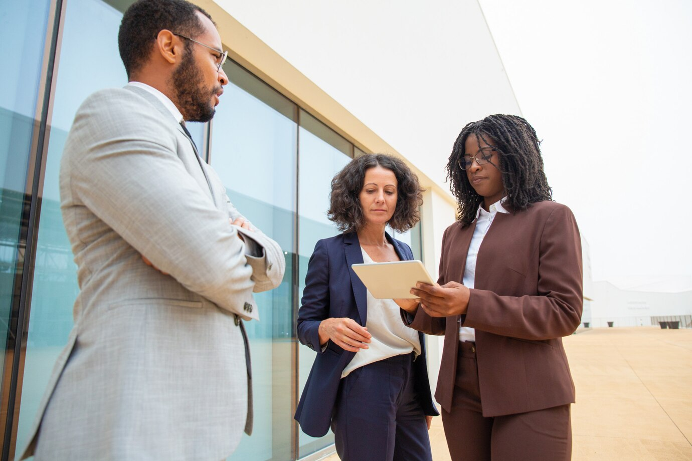 Diverse business colleagues discussing a project with a tablet