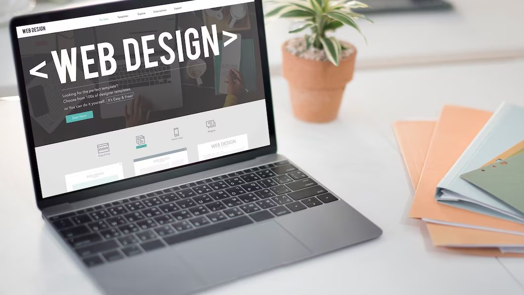 Designer sketching a responsive real estate website layout