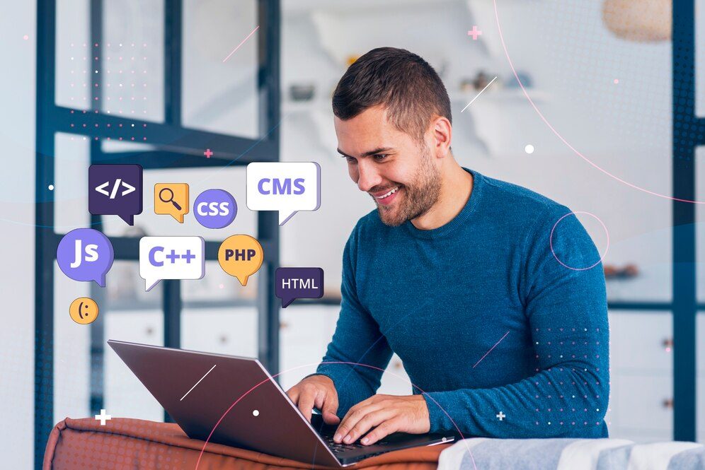 Developer writing HTML code in front of a computer