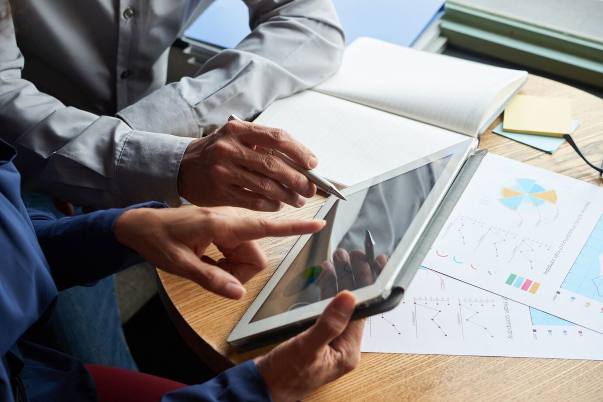 Person analyzing a performance report with charts