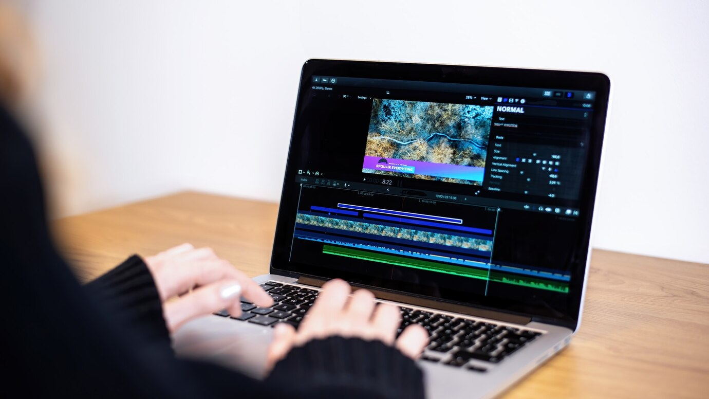 Realtor editing a property video at home